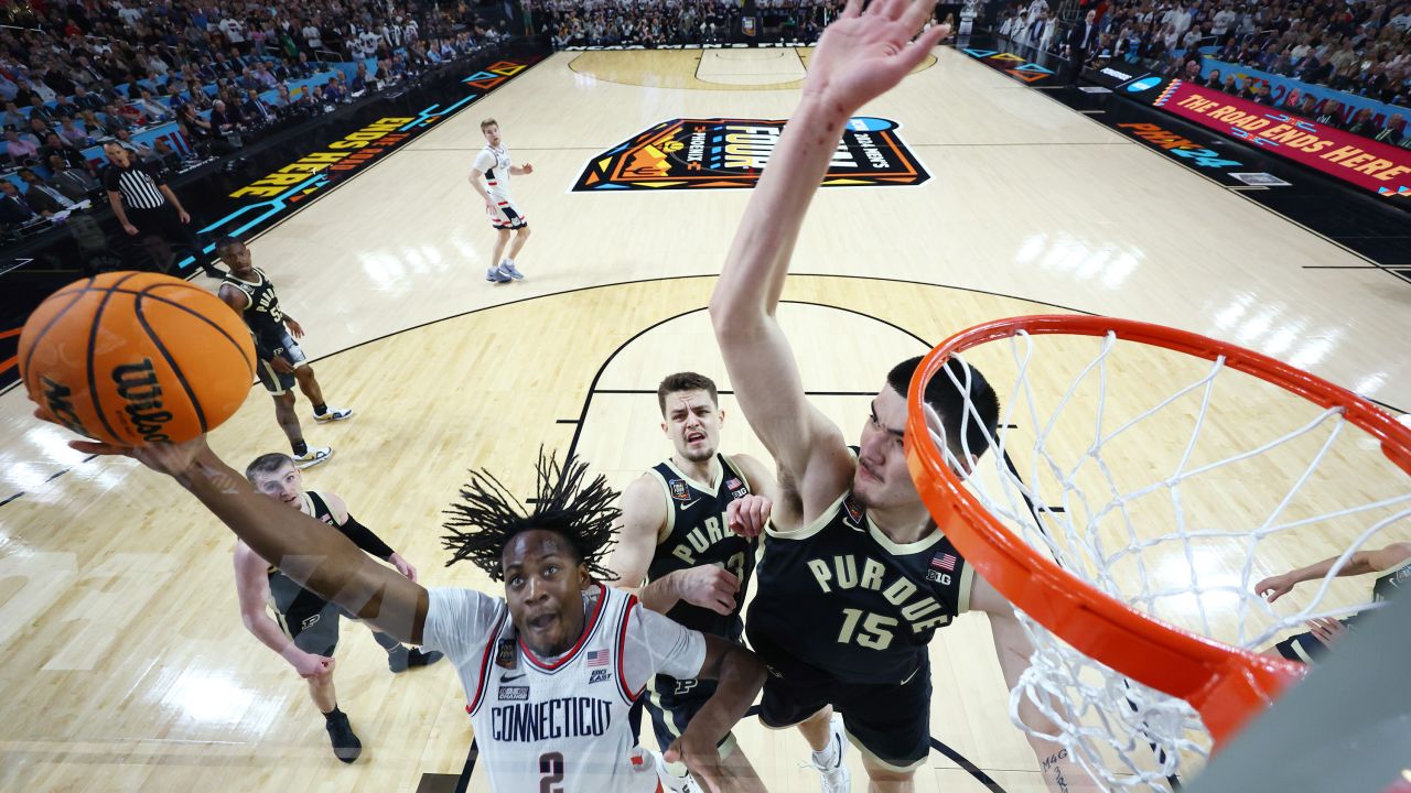 GLENDALE, ARIZONA - APRIL 08: (EDITORS NOTE: Image taken using a remote camera.) Tristen Newton #2 of the Connecticut Huskies shoots with Zach Edey #15 of the Purdue Boilermakers defending during the first half in the NCAA Men's Basketball Tournament National Championship game at State Farm Stadium on April 08, 2024 in Glendale, Arizona. (Photo by Brett Wilhelm/NCAA Photos via Getty Images)