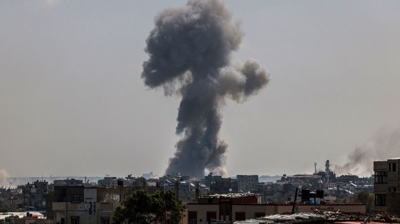 TOPSHOT - A billow of smoke rises following Israeli bombardment in Nuseirat, central Gaza, on April 12, 2024, amid ongoing battles between Israel and the Palestinian militant group Hamas. (Photo by AFP) (Photo by -/AFP via Getty Images)