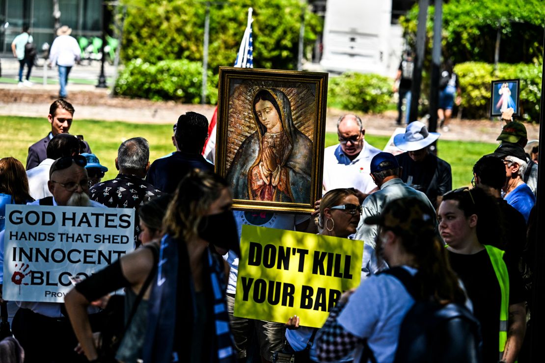 Anti-abortion activists counter-protest near a rally to protect abortion rights in Orlando, Florida, on April 13, 2024.