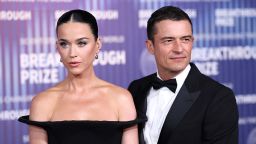 US singer Katy Perry (L) and English actor Orlando Bloom arrive at the Tenth Breakthrough Prize Ceremony at the Academy Museum of Motion Pictures in Los Angeles, California, on April 13, 2024. (Photo by Etienne Laurent / AFP) (Photo by ETIENNE LAURENT/AFP via Getty Images)