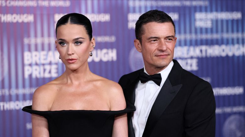 US singer Katy Perry (L) and English actor Orlando Bloom arrive at the Tenth Breakthrough Prize Ceremony at the Academy Museum of Motion Pictures in Los Angeles, California, on April 13, 2024.