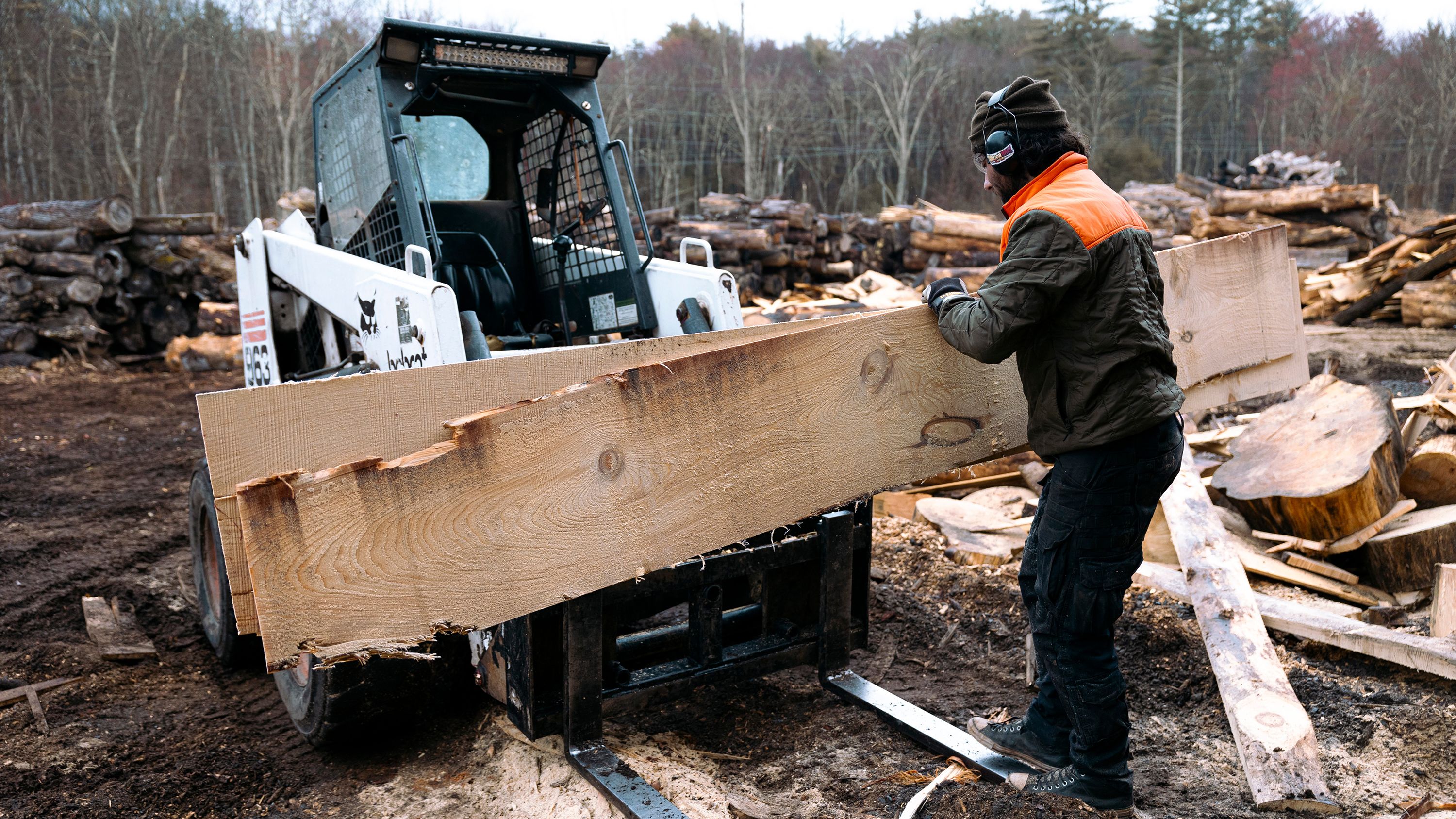 A worker stacks off-cut planks of pine wood on a forklift at Woodstock Wood sawmill in Saugerties, New York, on April 10, 2024.