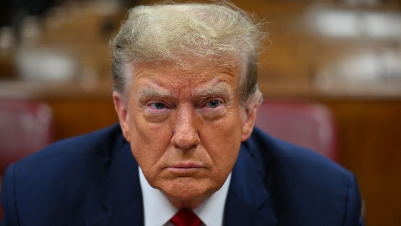 Former US President Donald Trump attends the first day of his trial for allegedly covering up hush money payments linked to extramarital affairs, at Manhattan Criminal Court in New York City on April 15, 2024. Trump is in court Monday as the first US ex-president ever to be criminally prosecuted, a seismic moment for the United States as the presumptive Republican nominee campaigns to re-take the White House. The scandal-plagued 77-year-old is accused of falsifying business records in a scheme to cover up an alleged sexual encounter with adult film actress Stormy Daniels to shield his 2016 election campaign from adverse publicity. (Photo by ANGELA WEISS / POOL / AFP) (Photo by ANGELA WEISS/POOL/AFP via Getty Images)