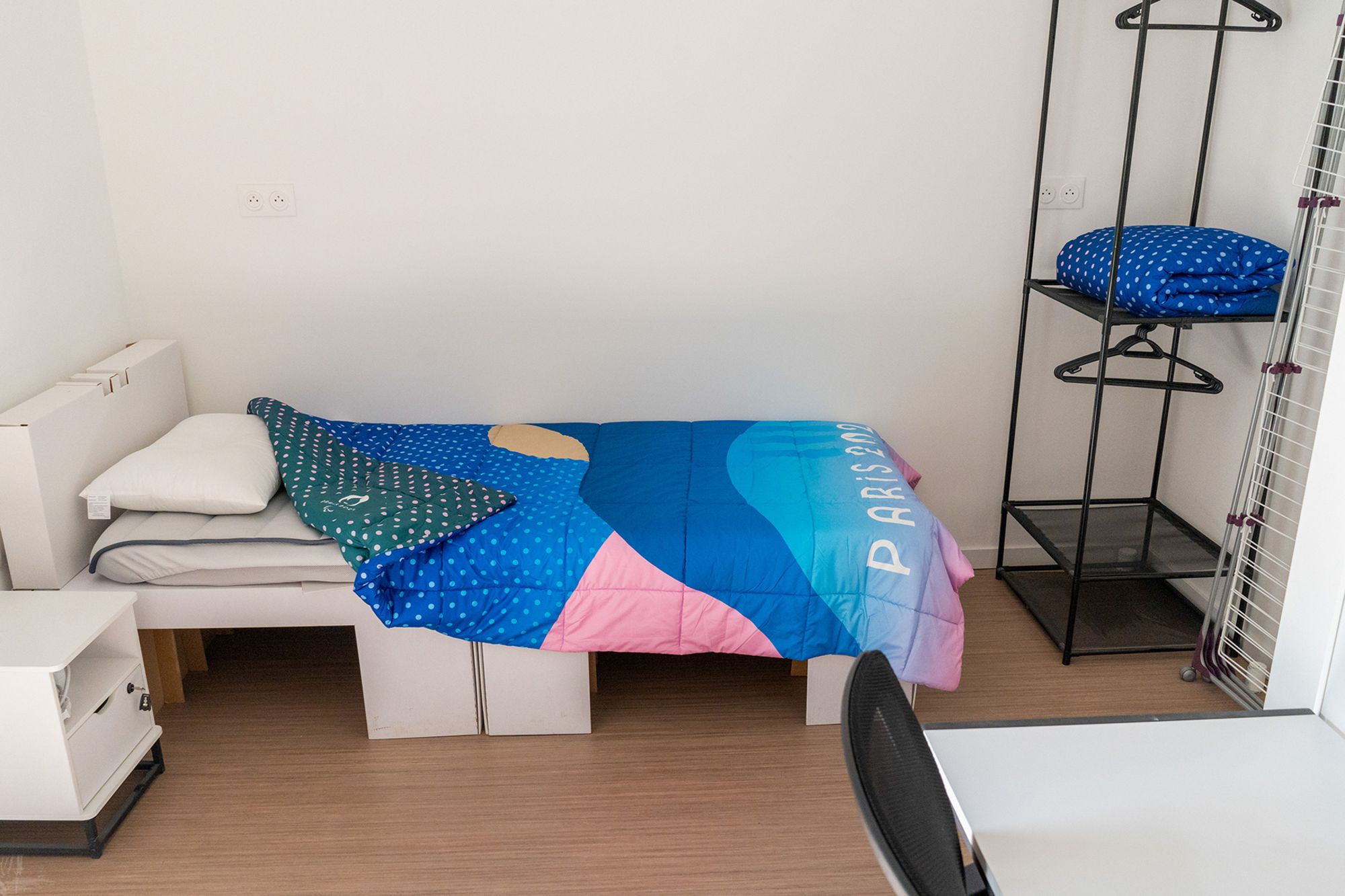 A cardboard bed inside an athletes' room at the Olympic Village in Saint-Denis, France.