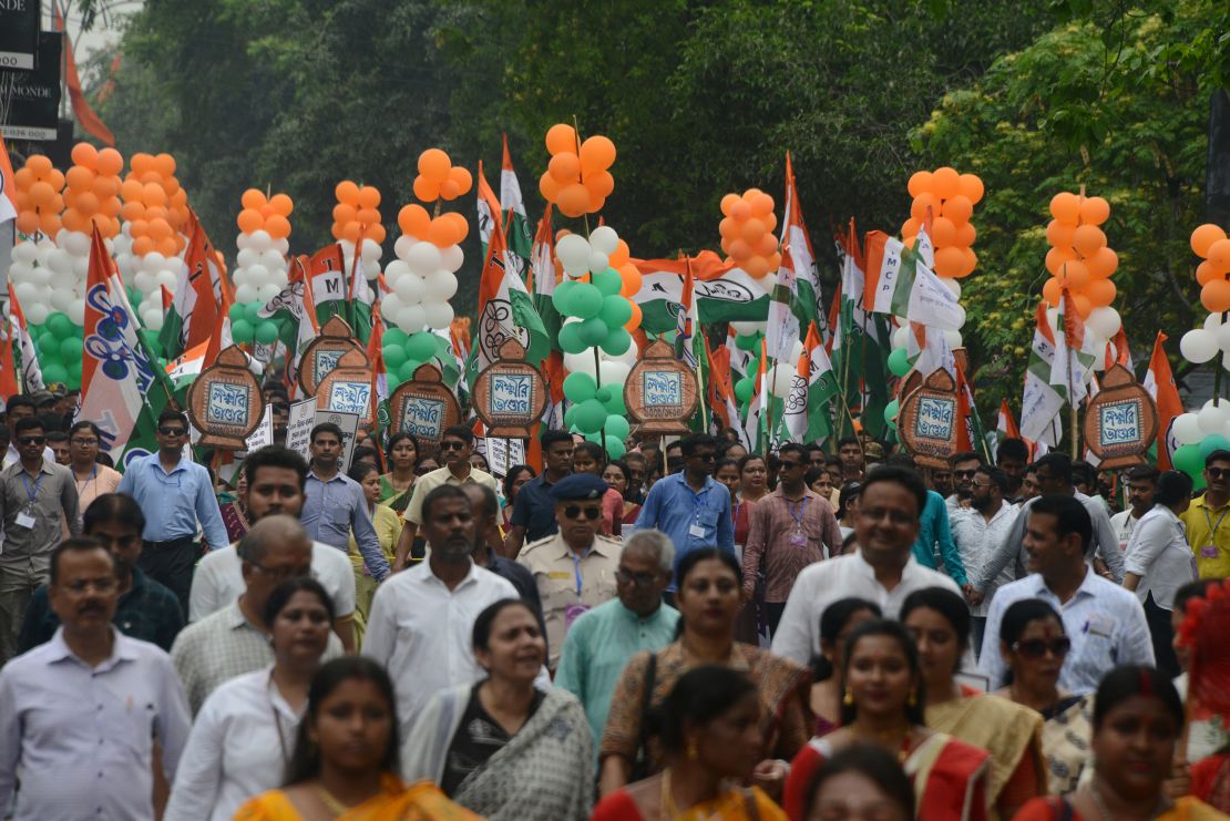 Supporters of the All India Trinamool Congress (AITC) participate in an election campaign rally on Hill Cart Road in Siliguri, India, on April 16, 2024.