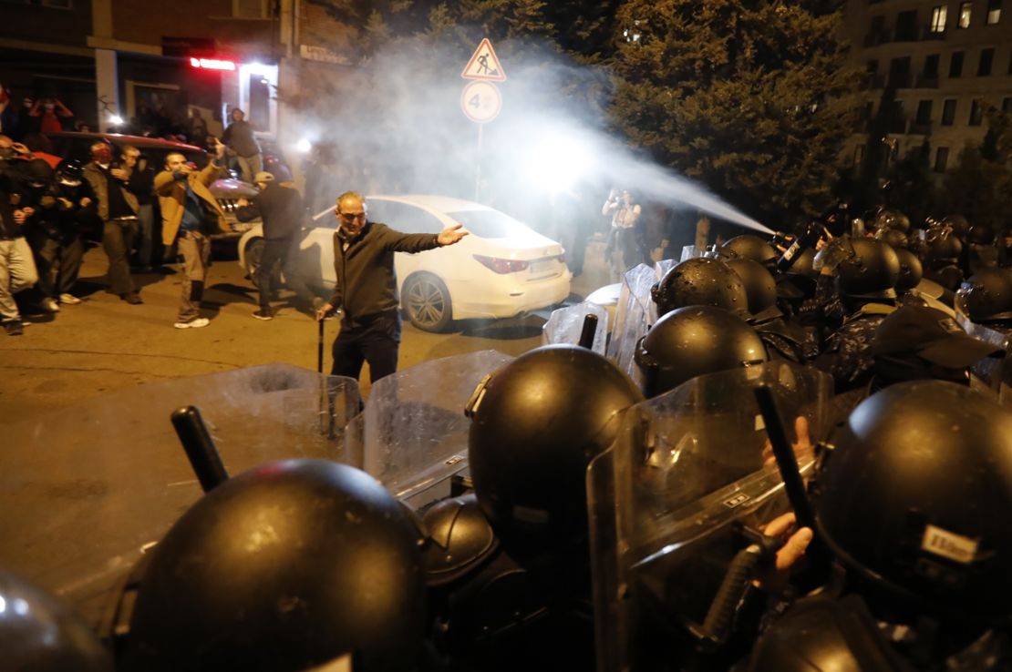 Police spray tear gas at protesters demonstrating against the "foreign agent" law in Tbilisi, April 16, 2024.