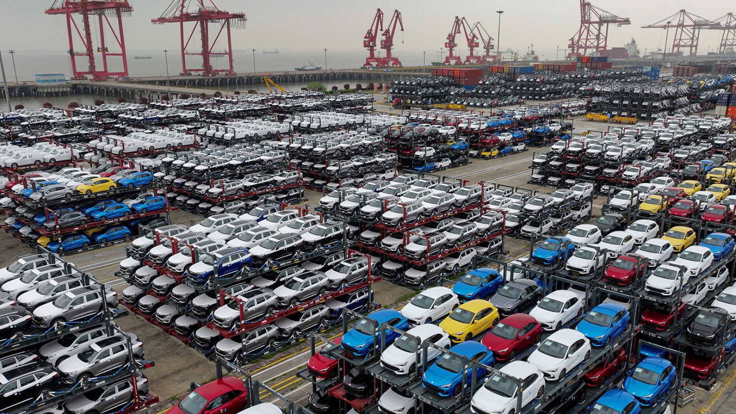 Electric cars ready for export are stacked at an international container terminal in eastern China's Suzhou last month.