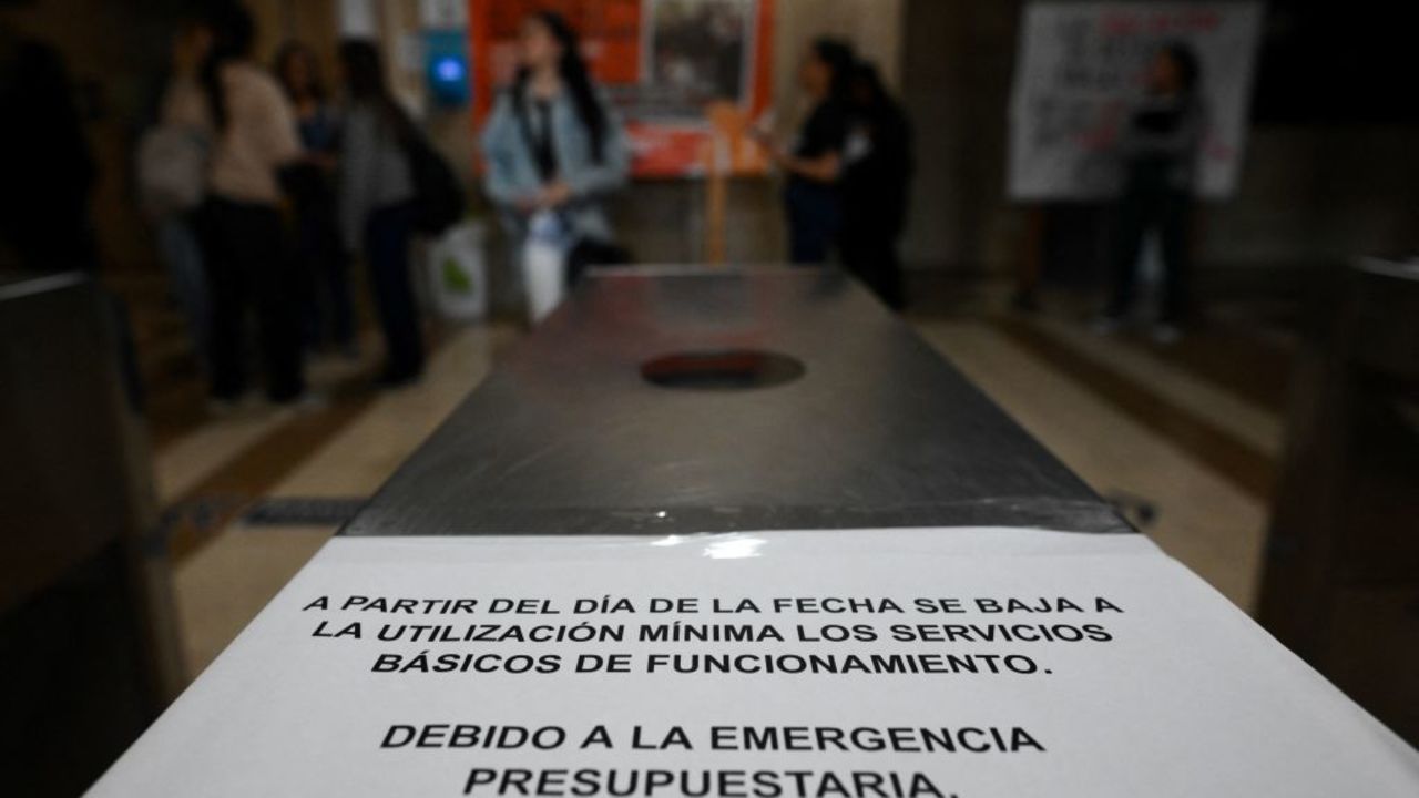 A sign announcing the measures taken to restrict the use of electricity due to budget cuts to public education is seen at University of Buenos Aires' (UBA) medicine school in Buenos Aires, on April 17, 2024. Directors and students of public universities called for a march next April 23 to protest against the budget cut to public education, as part of the economic adjustment policy of the government of President Javier Milei. (Photo by LUIS ROBAYO / AFP) (Photo by LUIS ROBAYO/AFP via Getty Images)