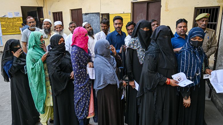 Voters queue at a polling station in Muzaffarnagar district, Uttar Pradesh, India, on Friday, April 19, 2024.
