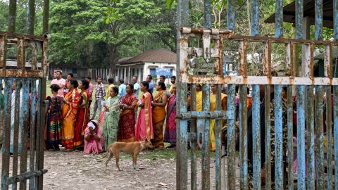 People queue to cast their votes in the country's West Bengal state on April 19, 2024.