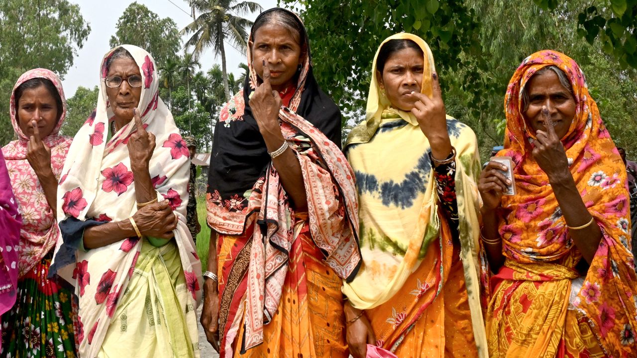 Women shows their inked fingers after casting their ballots to vote in the first phase of India's general election outside a polling station near the India-Bangladesh border in Seoraguri village, Dinhata district of Cooch Behar in the country's West Bengal state on April 19, 2024. (Photo by Dibyangshu SARKAR / AFP) (Photo by DIBYANGSHU SARKAR/AFP via Getty Images)