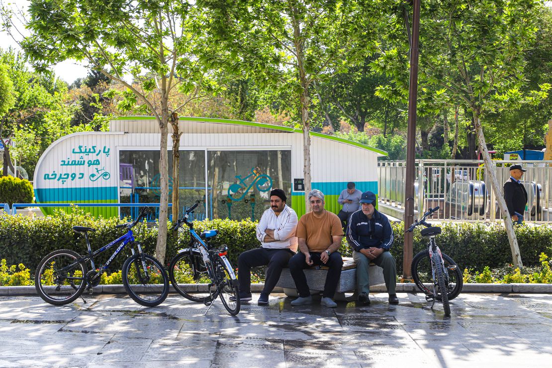 People walk on the streets and as they continue their daily lives after the news of the attacks in Isfahan, Iran on Friday.