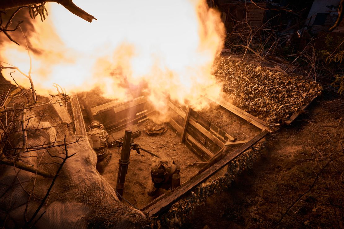 Ukrainian soldiers fire a 120 mm mortar on April 19, 2024.