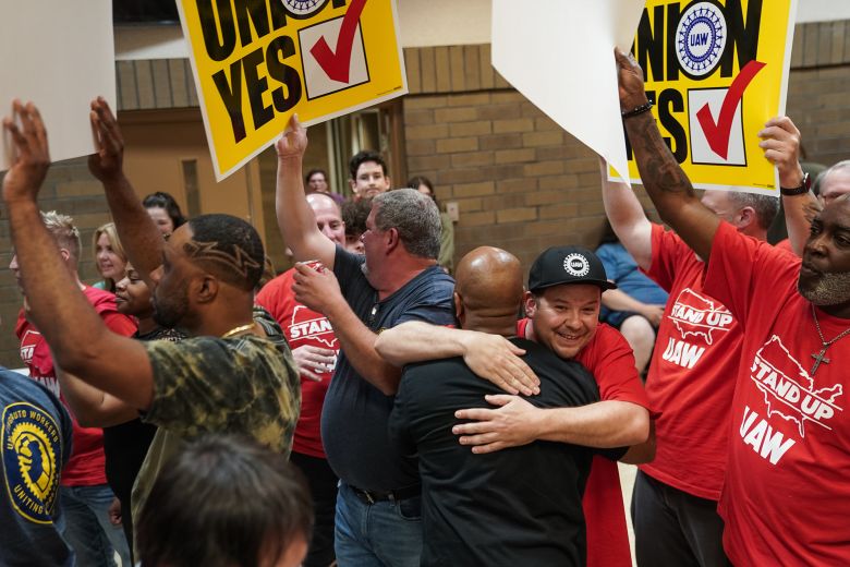 Volkswagen workers celebrate after the United Auto Workers (UAW) received enough votes to form a union at a UAW vote watch party on April 19, 2024, in Chattanooga, Tennessee.