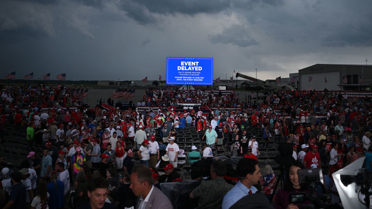 Supporters of former US President and 2024 Republican presidential candidate Donald Trump are asked to move to a shelter as a storm moves in before Trump's speech at a campaign rally in Wilmington, North Carolina, on April 20, 2024. The event was eventually cancelled because of the storm with Trump reportedly speaking to the crowd from his plane. (Photo by Jim WATSON / AFP) (Photo by JIM WATSON/AFP via Getty Images)