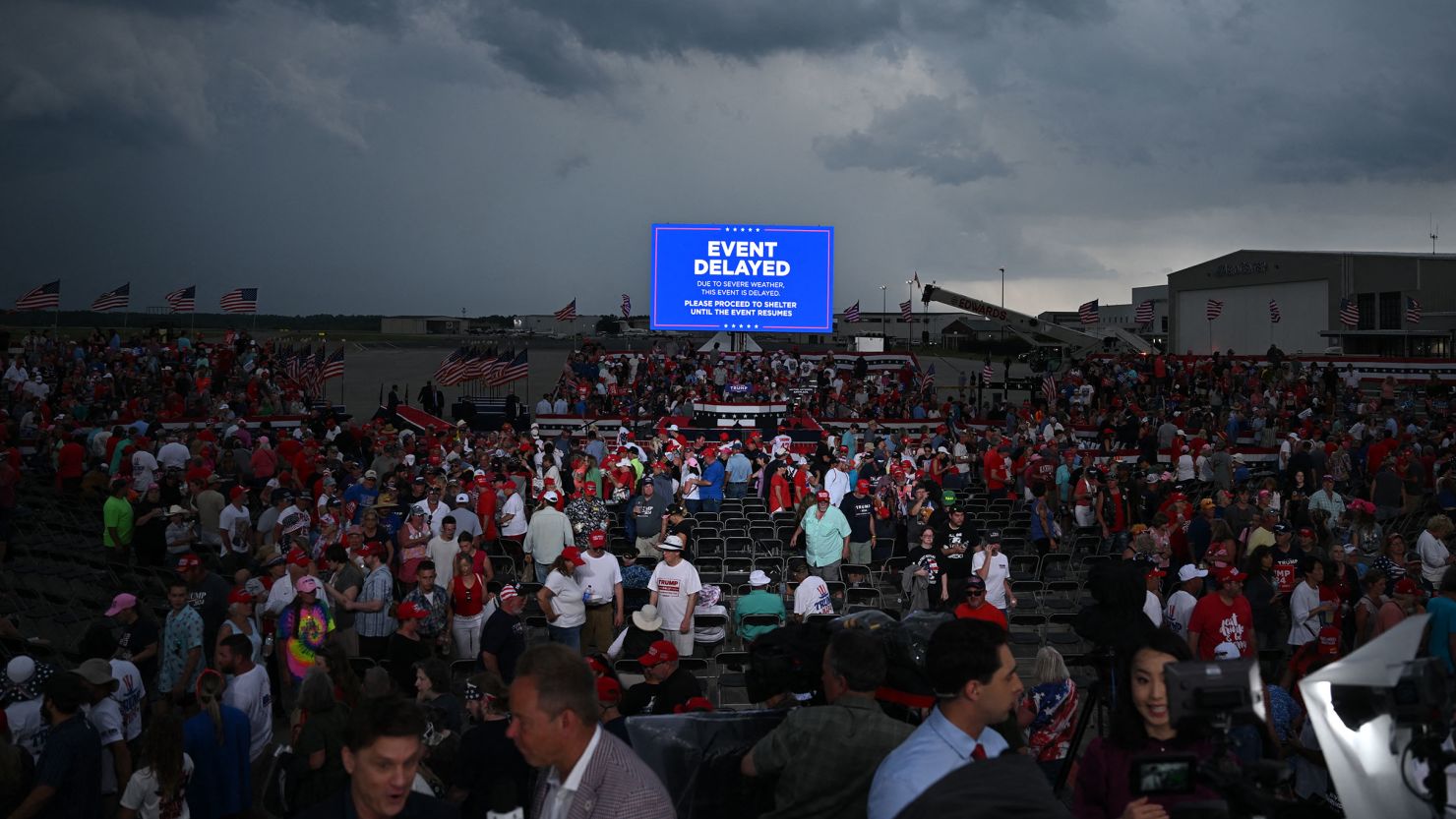 Supporters of former President Donald Trump are asked to move to shelter as a storm moves in before Trump was scheduled to speak at a campaign rally in Wilmington, North Carolina, on April 20, 2024.