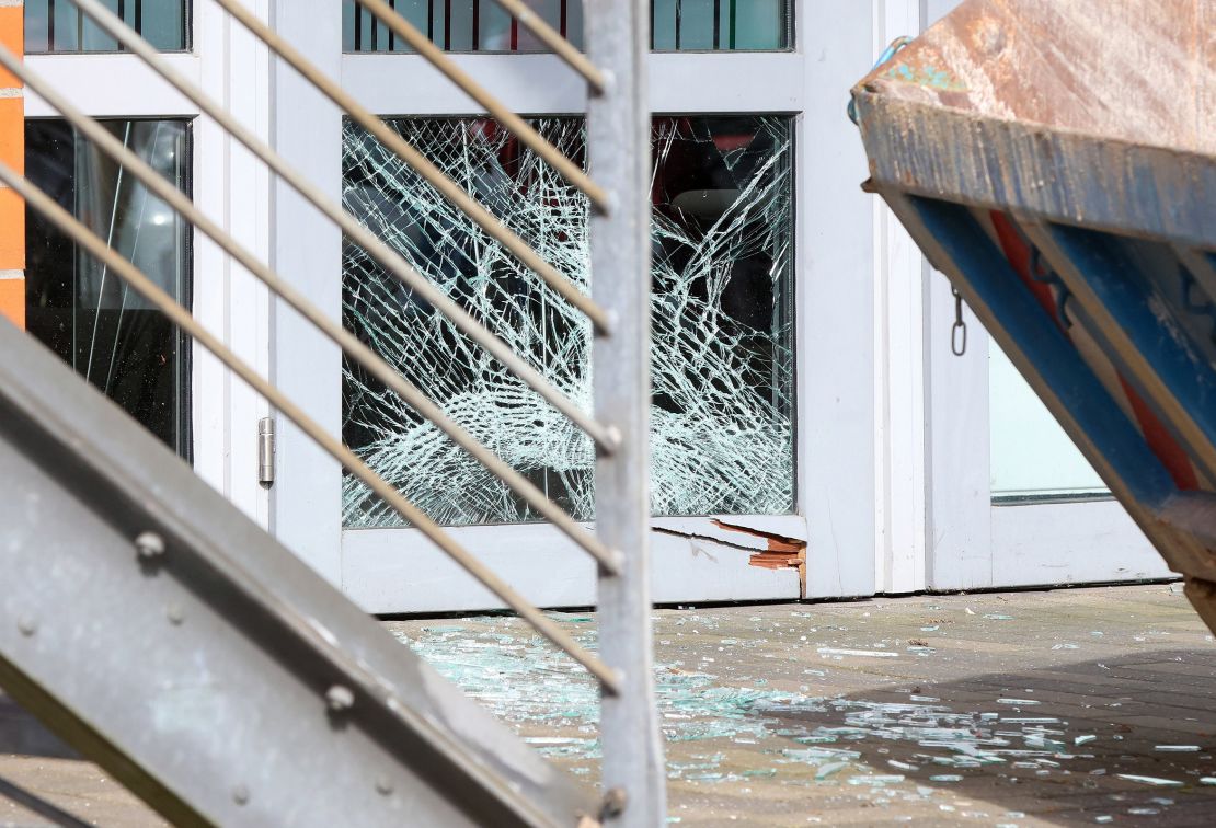 A broken window can be seen on the door of a branch of Sparkasse at a shopping center in Schenefeld, Germany, on April 22, 2024.