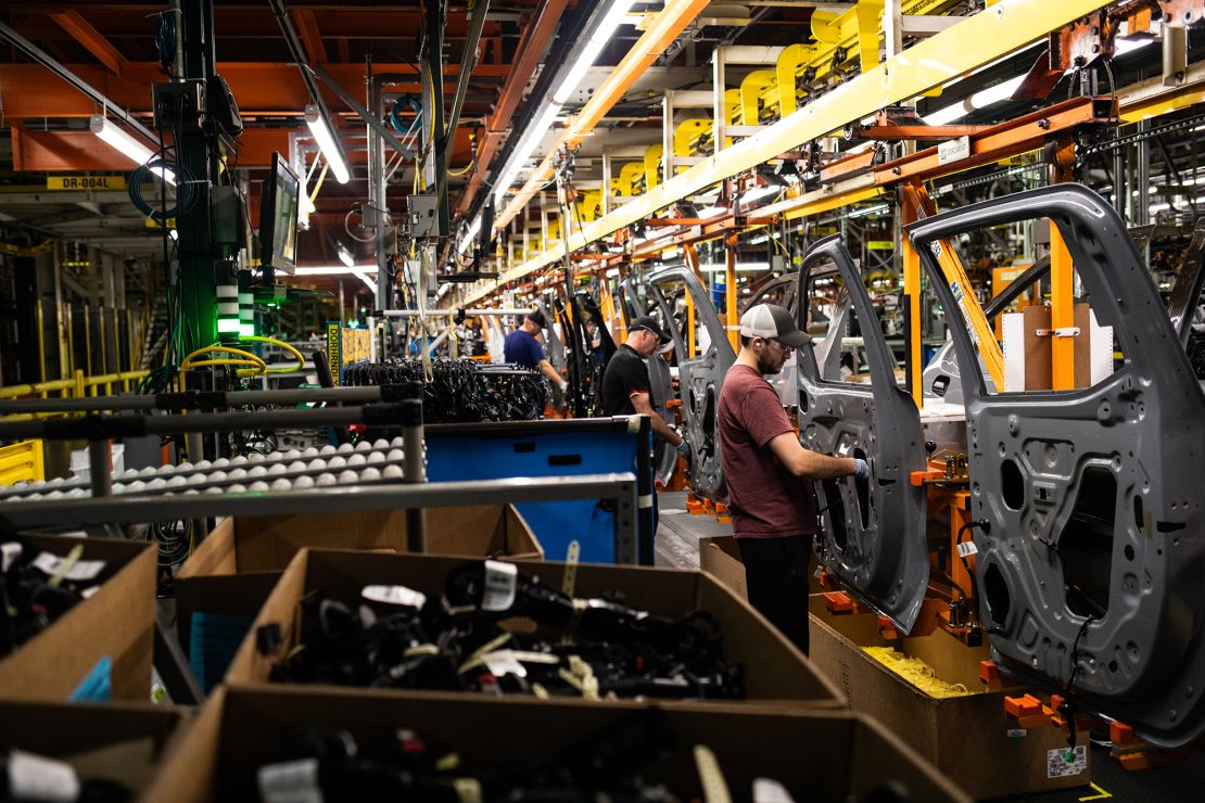 Workers assemble vehicle doors at the General Motors assembly plant in Fort Wayne, Indiana, in April 2024.