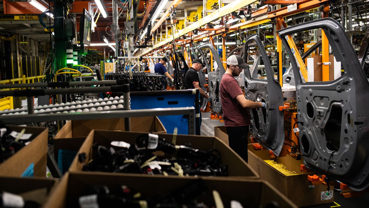 Workers assemble vehicle doors at the General Motors assembly plant in Fort Wayne, Indiana. GM earnings topped forecasts in the first quarter.