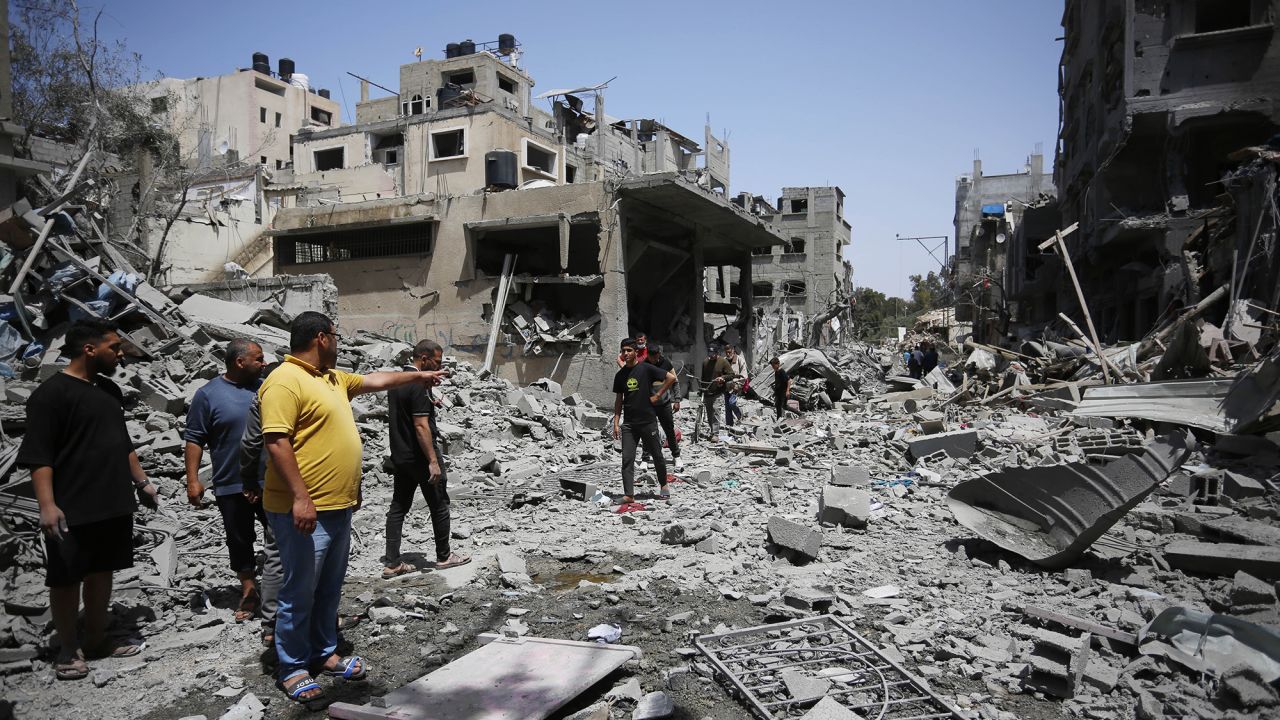 DEIR AL-BALAH, GAZA - APRIL 22: Palestinians inspect the destroyed buildings after the Israeli attack on the Bureij refugee camp as Israeli attacks continue in Gaza City, Gaza on April 22, 2024. (Photo by Ashraf Amra/Anadolu via Getty Images)