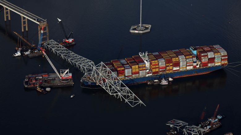 BALTIMORE, MARYLAND - APRIL 09:  In an aerial view, salvage crews continue to remove wreckage from the cargo ship Dali after it stuck and collapsed the Francis Scott Key Bridge, April 09, 2024 in Baltimore, Maryland. The Unified Command has started removing containers from the Dali while also working to clear the channel to restore the flow of commerce to the Port of Baltimore. The bridge collapsed after being struck by the 984-foot cargo ship Dali at 1:30 AM on March 26. (Photo by Kevin Dietsch/Getty Images)