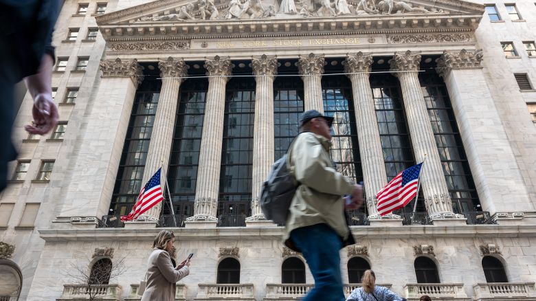 People walk past the New York Stock Exchange (NYSE) on April 10, 2024 in New York City.