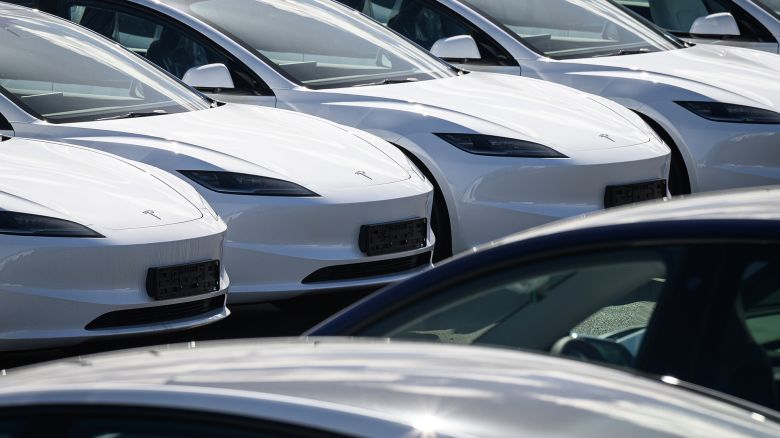 LONDON, ENGLAND - APRIL 15: Rows of new Tesla cars are seen in a holding area near a customer collection point on April 15, 2024 in London, England. According to a memo sent to staff today, the company will reduce its global workforce by 10%. As of last December, it had just over 140,000 employees according to its last annual report.