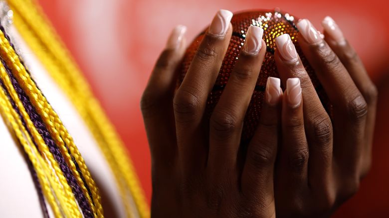 NEW YORK, NEW YORK - APRIL 15: A detailed view of a bejeweled basketball is seen in the hands of Aaliyah Edwards prior to the 2024 WNBA Draft at Brooklyn Academy of Music on April 15, 2024 in New York City. (Photo by Sarah Stier/Getty Images)