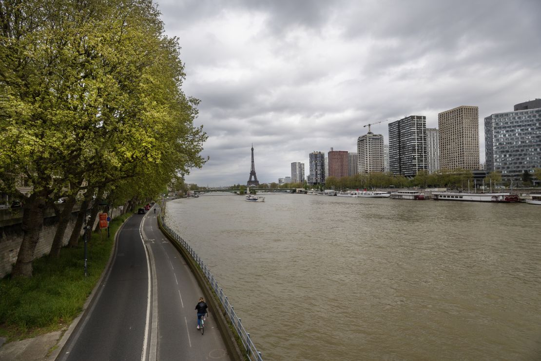 PARIS, FRANCE - APRIL 11: The River Seine runs through the city with the Eiffel Tower in Paris, France, in the background. The river is to be used for events in the Paris Olympic Games 2024, including the swimming portion of the triathlon, but concerns of E.coli levels in the water are putting the use of the river in jeopardy on April 11th, 2024 in Paris, France (Photo by Tim Clayton/Corbis via Getty Images)