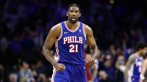 Joel Embiid and the Philadelphia 76ers edged past the Miami Heat to reach the playoffs.