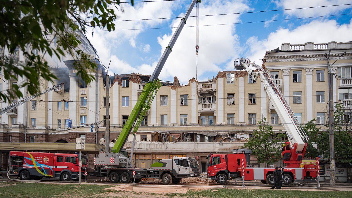 Firefighters respond to a building damaged by Russian shelling in Dnipro, Ukraine, April 19, 2024.