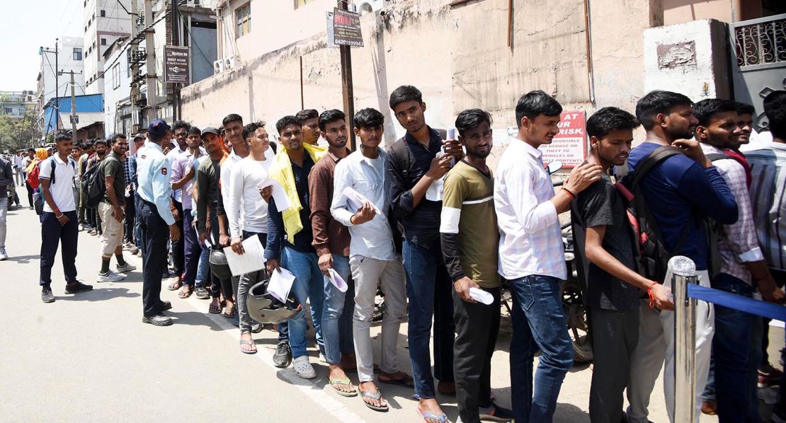 Applicants standing in queue for an Indian Army job exam in Pataliputra, India, on April 23, 2024.