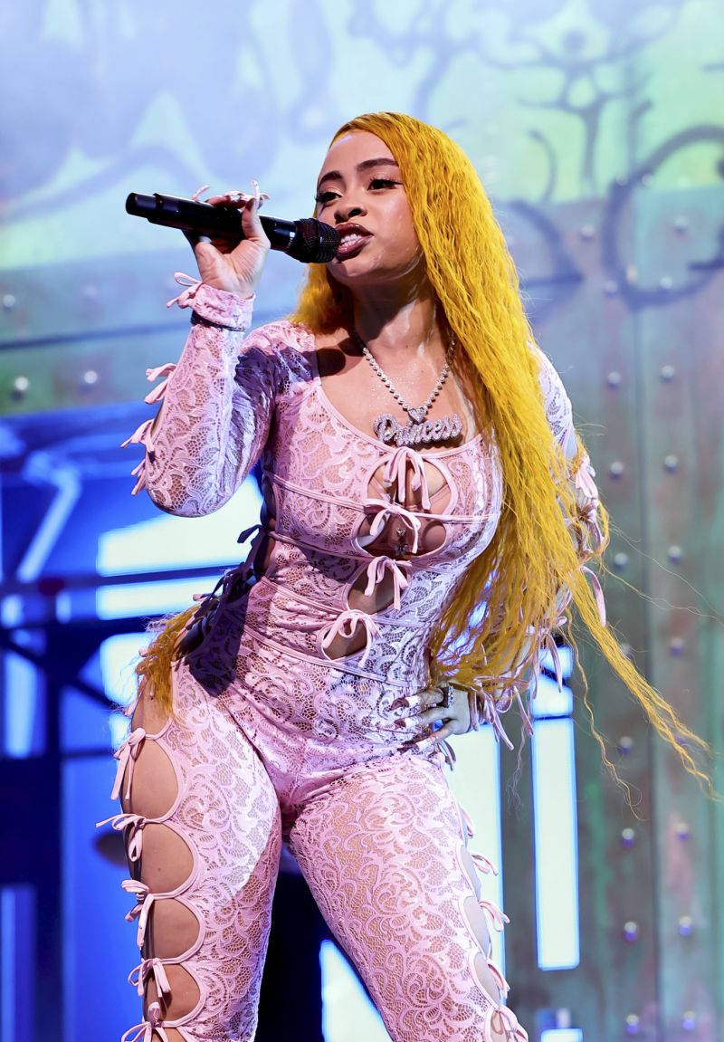 Ice Spice stepped out in a black I.AM.GIA lace catsuit during the first weekend, opting for this pink version for round two.