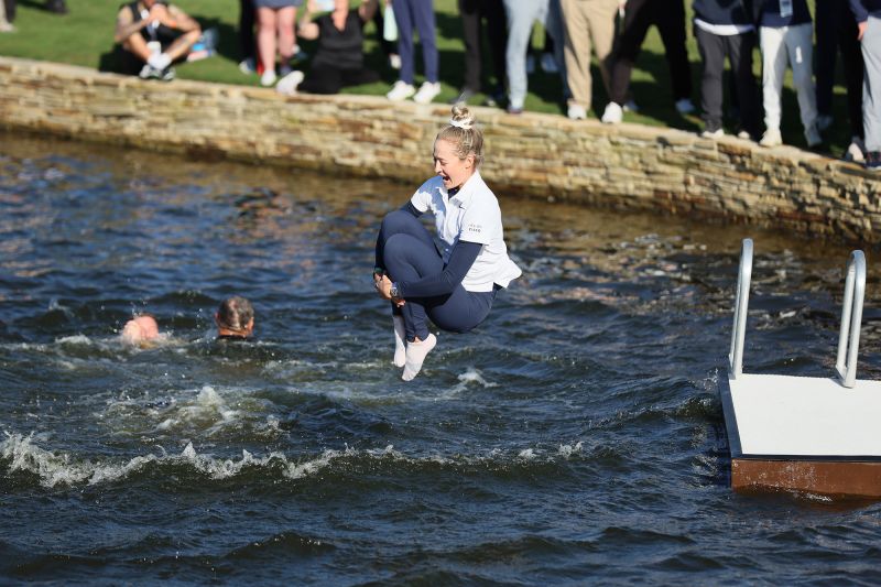 THE WOODLANDS, TEXAS - APRIL 21: Nelly Korda of the United States jumps into the water after winning The Chevron Championship at The Club at Carlton Woods on April 21, 2024 in The Woodlands, Texas. (Photo by Andy Lyons/Getty Images)