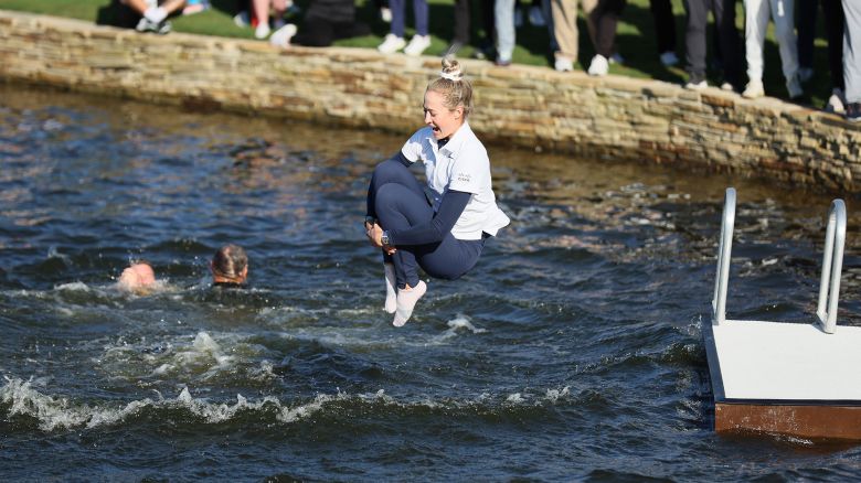 THE WOODLANDS, TEXAS - APRIL 21: Nelly Korda of the United States jumps into the water after winning The Chevron Championship at The Club at Carlton Woods on April 21, 2024 in The Woodlands, Texas. (Photo by Andy Lyons/Getty Images)