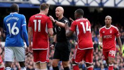 LIVERPOOL, ENGLAND - APRIL 21:  Referee Anthony Taylor is confronted by Chris Wood and Callum Hudson-Odoi of Nottingham Forest claiming a hand ball against Ashley Young of Everton (not pictured) during the Premier League match between Everton FC and Nottingham Forest at Goodison Park on April 21, 2024 in Liverpool, England. (Photo by Alex Livesey/Getty Images)