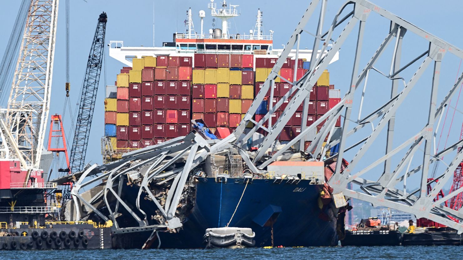 \Workers continue to clear the wreckage of the Francis Scott Key Bridge and the container ship Dali in Baltimore, Maryland, on April 26, 2024.