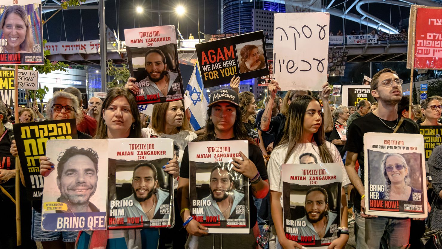 Relatives and supporters of Israeli hostages gather during a demonstration outside Israel's Ministry of Defense in Tel Aviv on Tuesday.