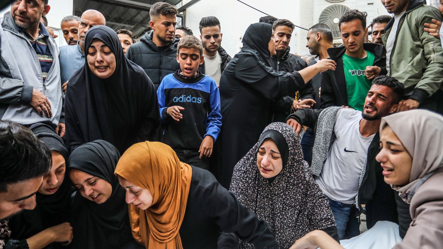Relatives of Palestinian victims who lost their lives following an Israeli airstrike in Rafah take their bodies from a hospital morgue for burial on April 29, 2024.
