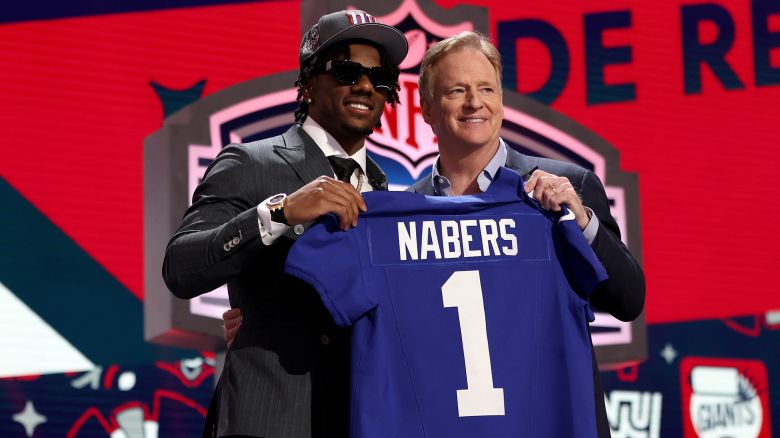 Malik Nabers poses with NFL Commissioner Roger Goodell after being selected sixth overall by the New York Giants during the first round of the 2024 NFL Draft at Campus Martius Park and Hart Plaza on April 25, 2024 in Detroit, Michigan.