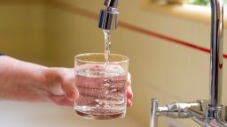SANTA ANA, CA - APRIL 26: Pouring a glass of water from a kitchen faucet in Santa Ana on Friday, April 26, 2024. According to a study by the US Geological Survey, 45% of the tap water in the United States is contaminated with "forever chemicals" that are considered dangerous to human health.  In recent years, studies have found that humans exposed to some PFAS chemicals are more prone to everything from high cholesterol and hypertension to testicular cancer, breast cancer and, for girls, early-onset puberty.  (Photo by Leonard Ortiz/MediaNews Group/Orange County Register via Getty Images)