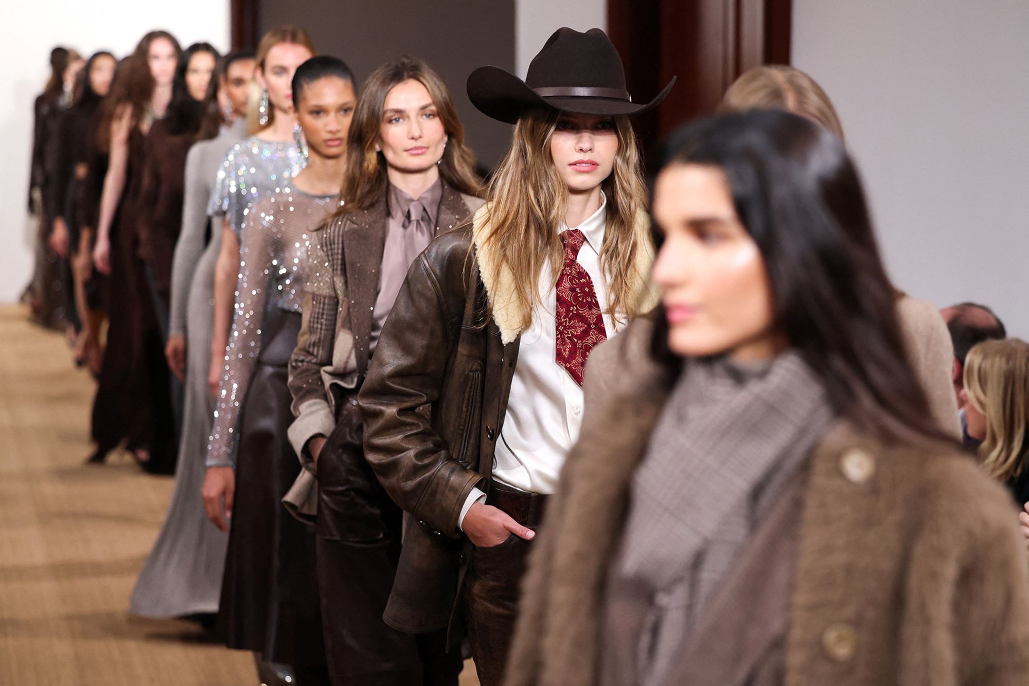 "Tailored and trim suit jackets, draped knits, suede and leather separates, and bias-cut gowns are a nod to Ralph Lauren’s most personal inspirations," the fashion label said of its latest collection in a statement.