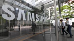 People walking past Samsung's Seocho building in Seoul on April 30, 2024