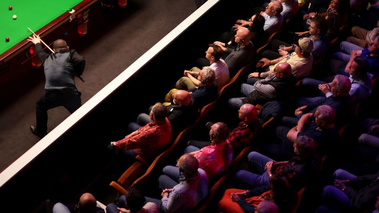 Stephen Maguire of Scotland plays a shot against Shaun Murphy of England in their round two match as spectators watch on during day seven of the Cazoo World Snooker Championship 2024 at Crucible Theatre in Sheffield, England on April 26, 2024.