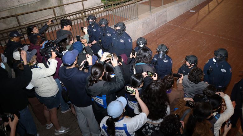 NYPD officers in riot gear enter Columbia University's encampment as they evict a building that had been barricaded by pro-Palestinian student protesters in New York City on April 30, 2024.