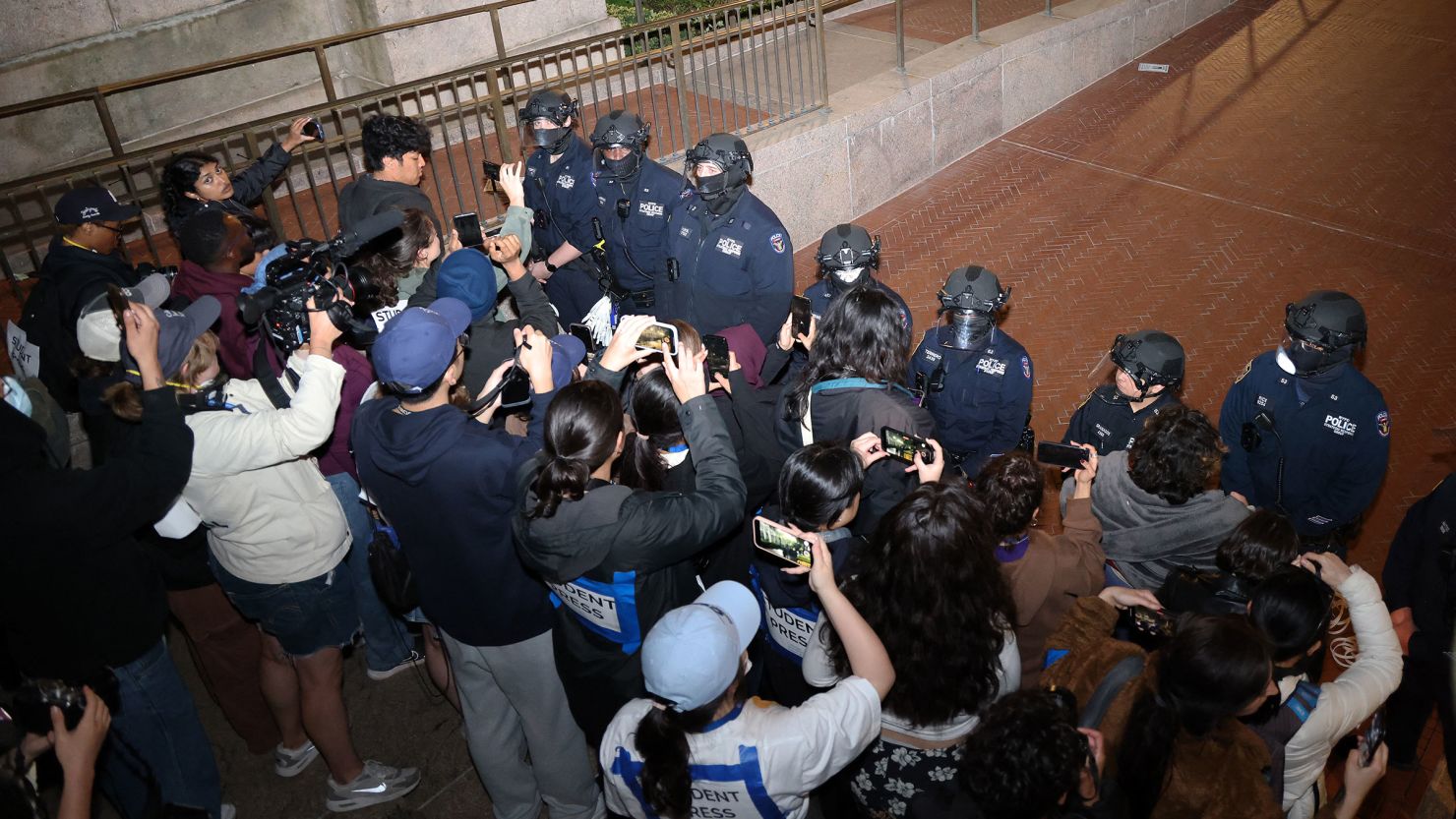 NYPD officers in riot gear enter Columbia University as a building had been barricaded by pro-Palestinian student protesters in New York City on April 30, 2024.