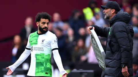 Mohamed Salah of Liverpool clashes with Jurgen Klopp, Manager of Liverpool, during the Premier League match between West Ham United and Liverpool FC at London Stadium on April 27, 2024 in London, England.