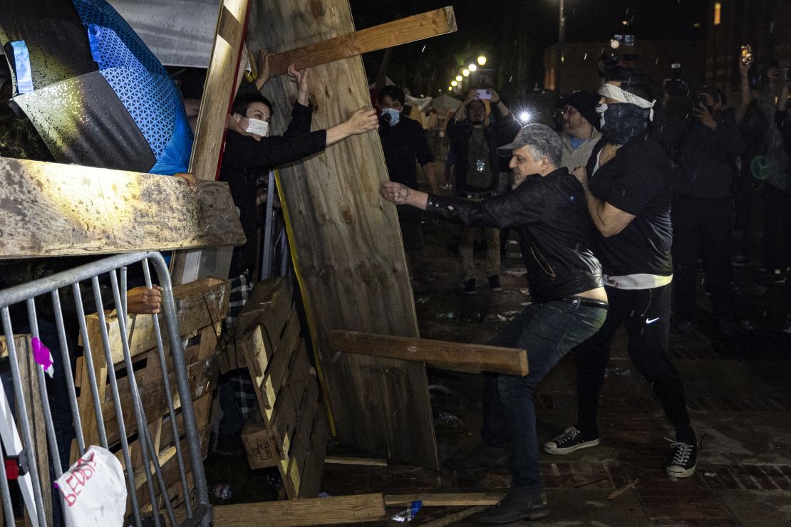 Counterprotesters attack a pro-Palestinian encampment set up on the campus of the University of California Los Angeles on May 1, 2024.