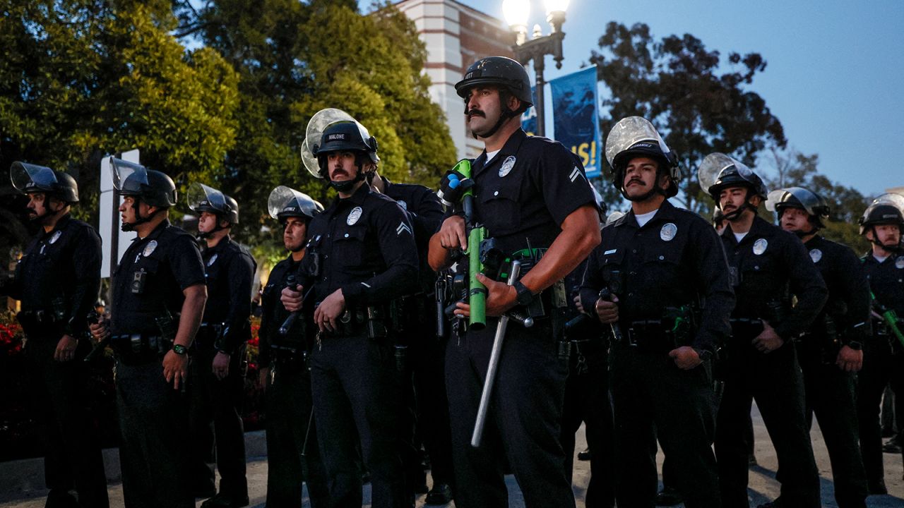 Police officers get into position as pro-Palestinian students and activists demonstrate on the campus of the University of California, Los Angeles (UCLA) in Los Angeles, California, on May 1, 2024.