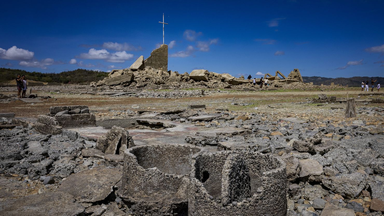 People visit the remnants of the old sunken town of Pantabangan on April 28, 2024 in Nueva Ecija province, Philippines.